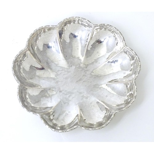 460 - A Continental .800 silver dish of lobed form with hammered decoration. Approx. 3 1/2