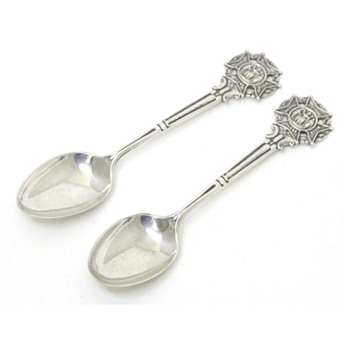 461 - A pair of silver teaspoons the handles surmounted by crest for Miniature Rifle Clubs Society, titled... 