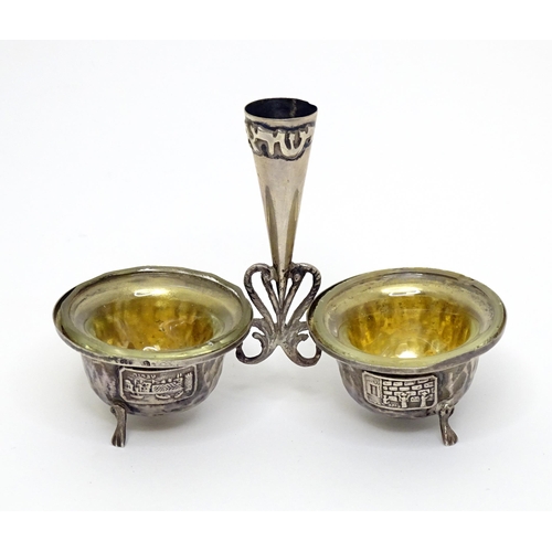 463 - Judaica : A .800 silver Israeli souvenir salt cruet with hammered decoration and scenes with Jerusal... 