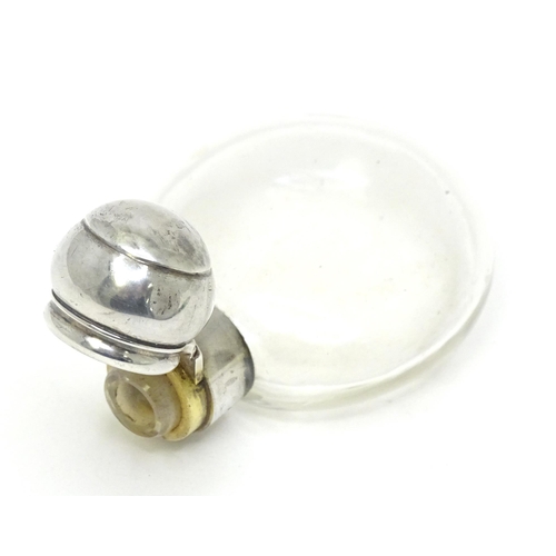 465 - A glass perfume / scent bottle with white metal top. Approx. 3