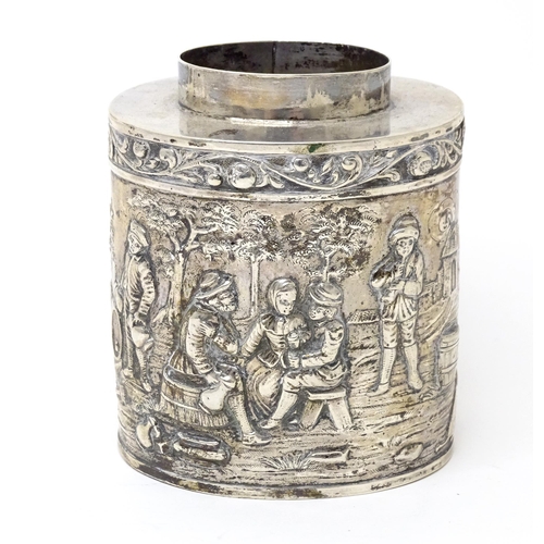 470 - A Continental silver caddy with embossed decoration depicting musicians, figures imbibing, dancing, ... 