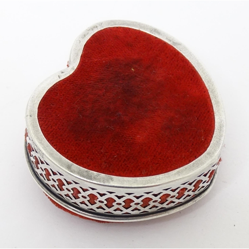 471A - An American pin cushion of heart form with a silver surround, By Webster Company. Approx. 2 1/4