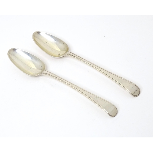 474 - A pair of 18thC silver Old English featheredge teaspoons hallmarked London, maker Thomas & William C... 