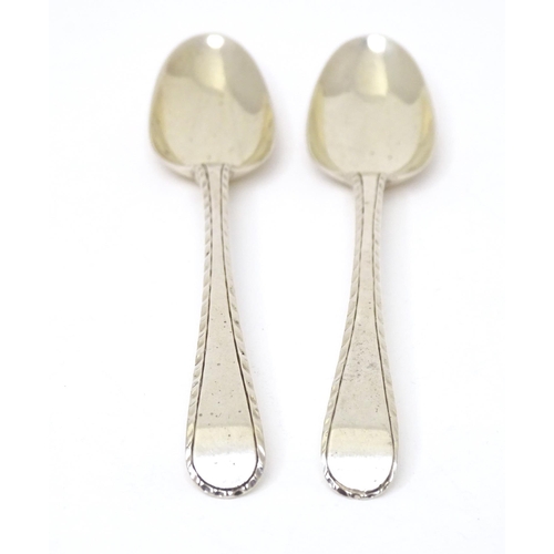 474 - A pair of 18thC silver Old English featheredge teaspoons hallmarked London, maker Thomas & William C... 