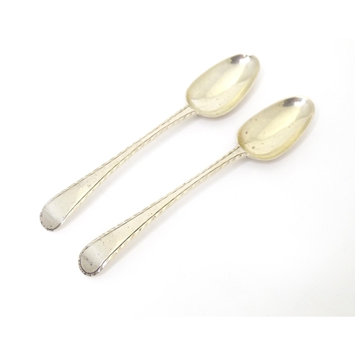 474 - A pair of 18thC silver Old English featheredge teaspoons hallmarked London, maker Thomas & William C... 