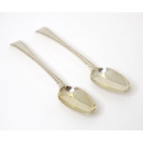 474 - A pair of 18thC silver Old English featheredge teaspoons hallmarked London, maker Thomas & William C... 