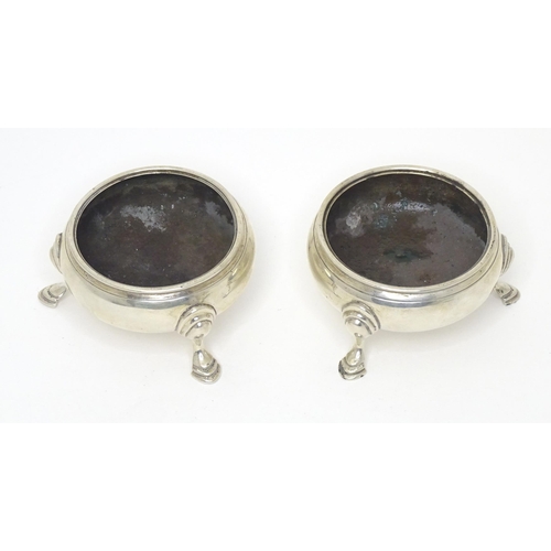 482 - A pair of Geo III silver salts, each raised on three hoof feet, hallmarked London 1769, maker IS & A... 