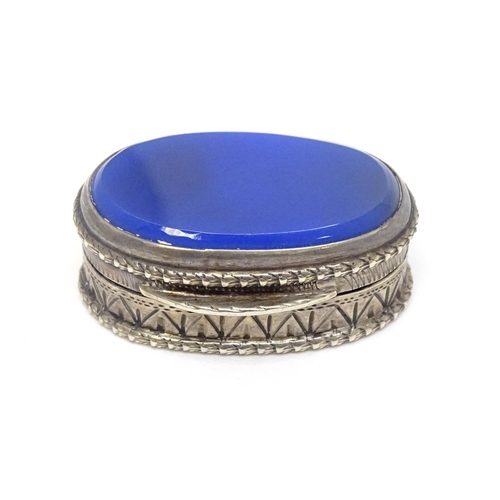 483 - A Continental .800 silver pill box with inset blue detail to top. Approx. 1 1/4