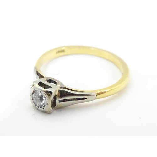 574 - An 18ct gold diamond solitaire ring in a square setting. Ring size approx O