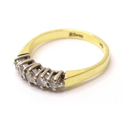 576 - An 18ct gold ring set with 5 diamonds. ring size approx. I