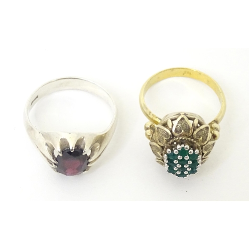 606 - A silver ring set with purple stone (Ring size approx. Q) Together with a silver gilt ring set with ... 