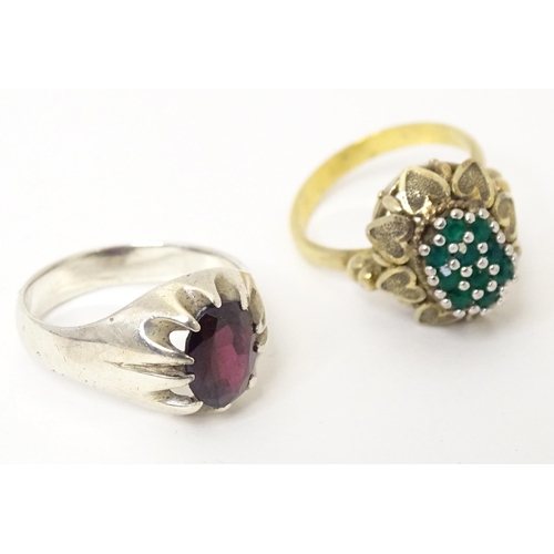 606 - A silver ring set with purple stone (Ring size approx. Q) Together with a silver gilt ring set with ... 