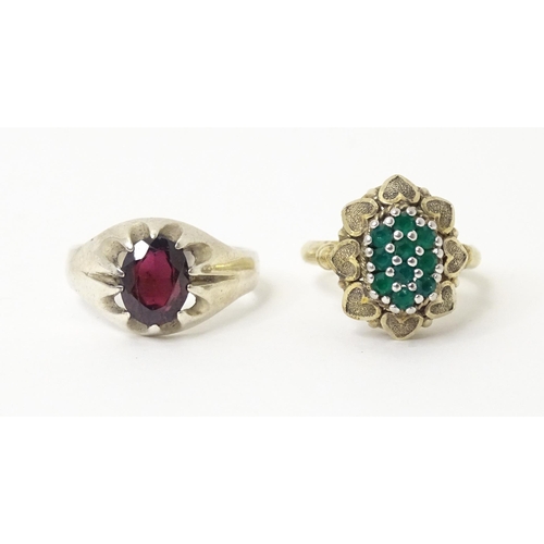 606 - A silver ring set with purple stone (Ring size approx. Q) Together with a silver gilt ring set with ... 