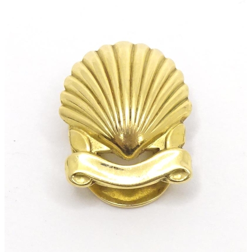 716 - A French gold stud / button of shell form by Cartier Paris. Marked verso and signed Cartier Paris.  ... 