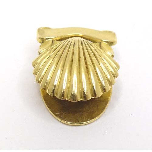 716 - A French gold stud / button of shell form by Cartier Paris. Marked verso and signed Cartier Paris.  ... 