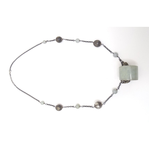 739 - A silver and white metal necklace set with white metal and jade coloured hardstone beads. Approx 30