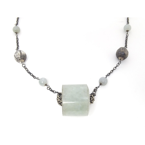 739 - A silver and white metal necklace set with white metal and jade coloured hardstone beads. Approx 30