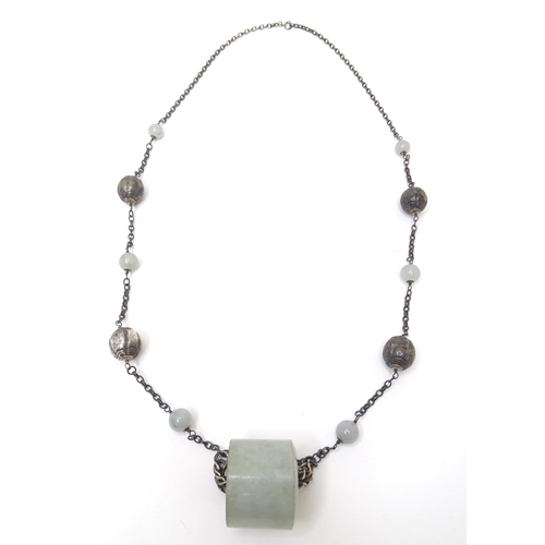 739 - A silver and white metal necklace set with white metal and jade coloured hardstone beads. Approx 30