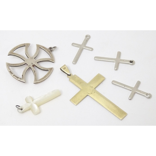 744 - Six assorted cross formed pendants to include silver and white examples, one hallmarked Birmingham 1... 