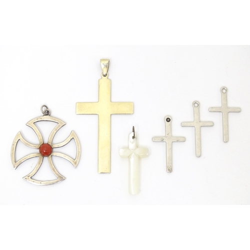 744 - Six assorted cross formed pendants to include silver and white examples, one hallmarked Birmingham 1... 