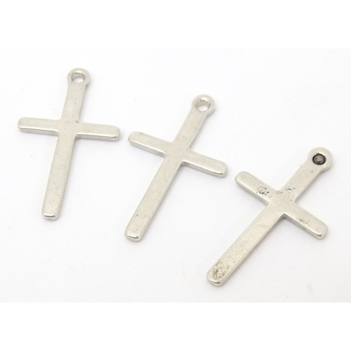 744 - Six assorted cross formed pendants to include silver and white examples, one hallmarked Birmingham 1... 