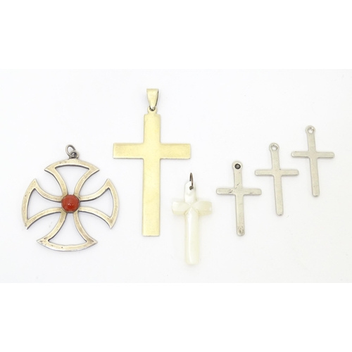 744 - Six assorted cross formed pendants to include silver and white examples, one hallmarked Birmingham 1... 