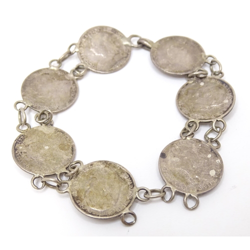 745 - A silver and white metal bracelet set with Victorian and later 3 pence coins. Together with a silver... 