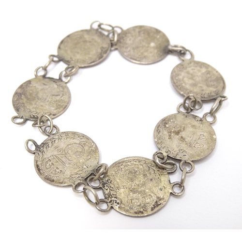 745 - A silver and white metal bracelet set with Victorian and later 3 pence coins. Together with a silver... 