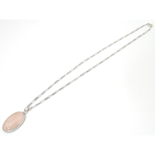 748 - A silver pendant set with rose quartz cabochon, Hallmarked London 1986 maker Tony Bestwick approx 1