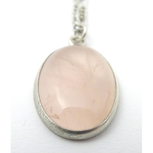 748 - A silver pendant set with rose quartz cabochon, Hallmarked London 1986 maker Tony Bestwick approx 1