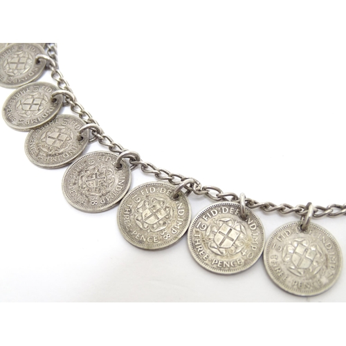 751 - Two white metal necklaces, one decorated with George VI three pence coins. Longest approx 22