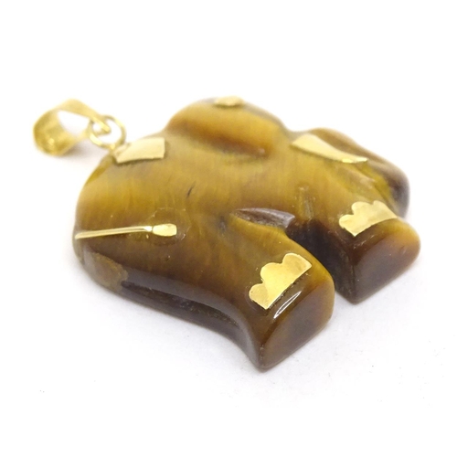 757 - A tigers eye pendant modelled as an elephant with 9ct gold mounts 1