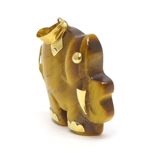 757 - A tigers eye pendant modelled as an elephant with 9ct gold mounts 1