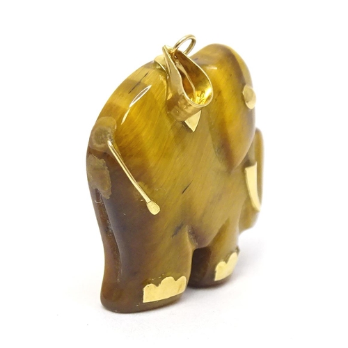 757 - A tigers eye pendant modelled as an elephant with 9ct gold mounts 1