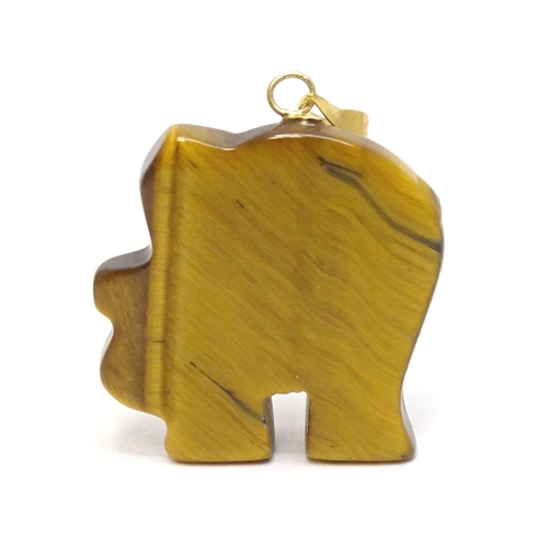 757 - A tigers eye pendant modelled as an elephant with 9ct gold mounts 1