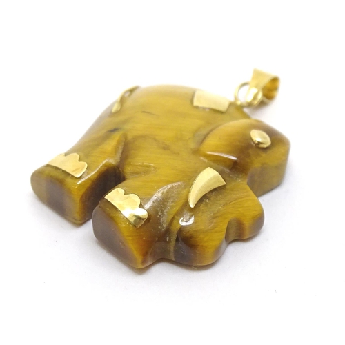 757 - A tigers eye pendant modelled as an elephant with 9ct gold mounts 1