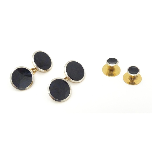 762 - A pair of 9ct gold cufflinks together with a pair of collar studs.