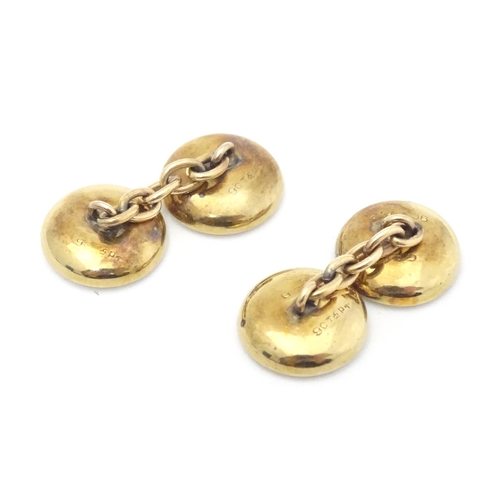 762 - A pair of 9ct gold cufflinks together with a pair of collar studs.