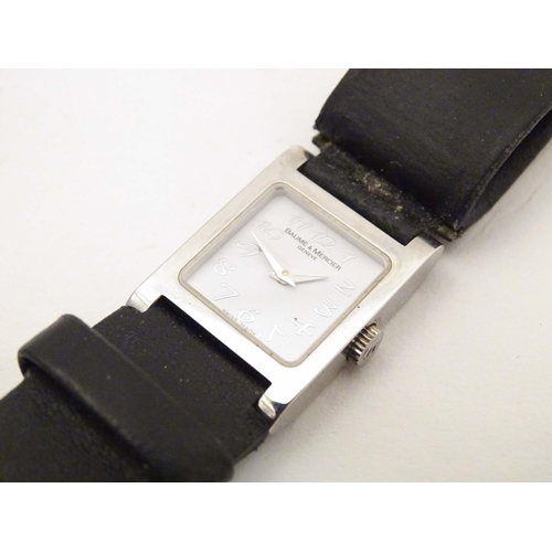 787 - A Baume & Mercier Vice Versa quartz wrist watch, the case signed and numbered having a black leather... 