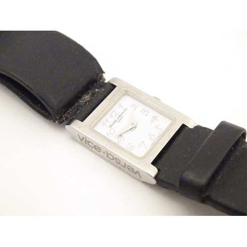 787 - A Baume & Mercier Vice Versa quartz wrist watch, the case signed and numbered having a black leather... 