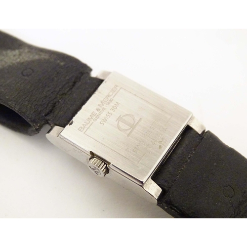 787 - A Baume & Mercier Vice Versa quartz wrist watch, the case signed and numbered having a black leather... 