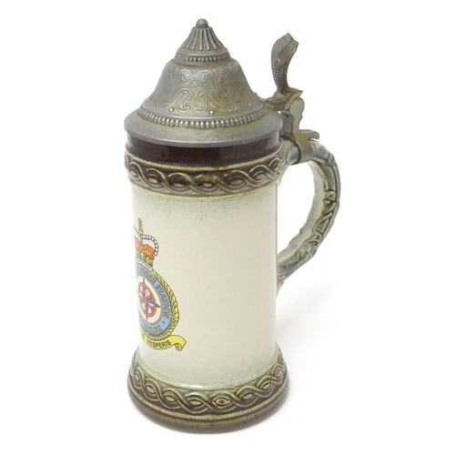 813 - Militaria : a mid 20thC stein tankard, decorated with the insignia of RAF Gütersloh (HQ No.2 Group R... 