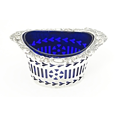 240 - A silver salt with fretwork decoration, hallmarked Birmingham 1906, maker S. M. Levi. Approx. 2 3/4