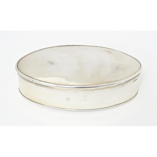 247 - A Continental white metal snuff box of oval form with gilded interior. Indistinctly marked. Approx. ... 