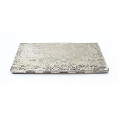 254 - An Art Deco silver cigarette case with engine turned decoration and gilded interior, hallmarked Birm... 