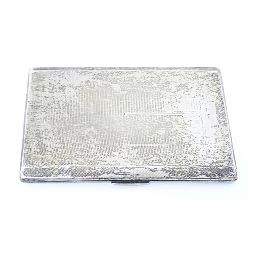 254 - An Art Deco silver cigarette case with engine turned decoration and gilded interior, hallmarked Birm... 