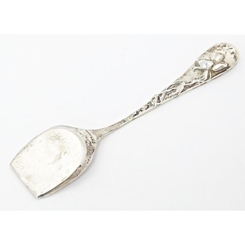 257 - A Continental .800 silver shovel formed spoon with Art Nouveau floral decoration to reverse of handl... 