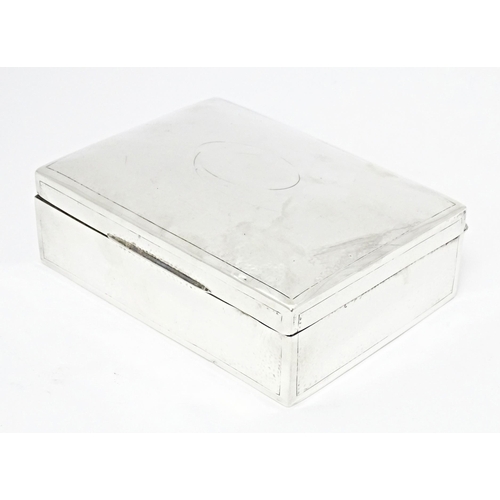 246 - A silver table top cigarette box with hammered decoration, hallmarked Birmingham 1902, maker Deakin ... 