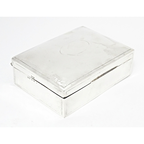 246 - A silver table top cigarette box with hammered decoration, hallmarked Birmingham 1902, maker Deakin ... 