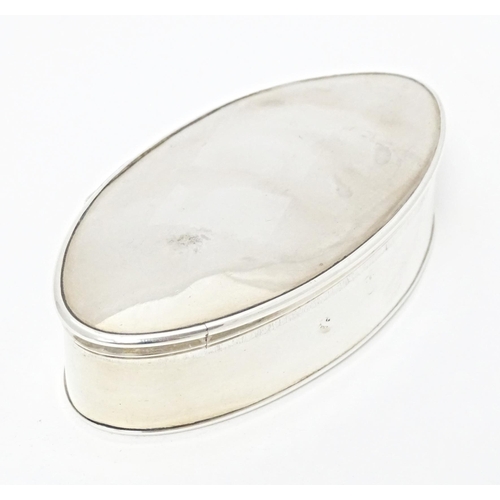 247 - A Continental white metal snuff box of oval form with gilded interior. Indistinctly marked. Approx. ... 